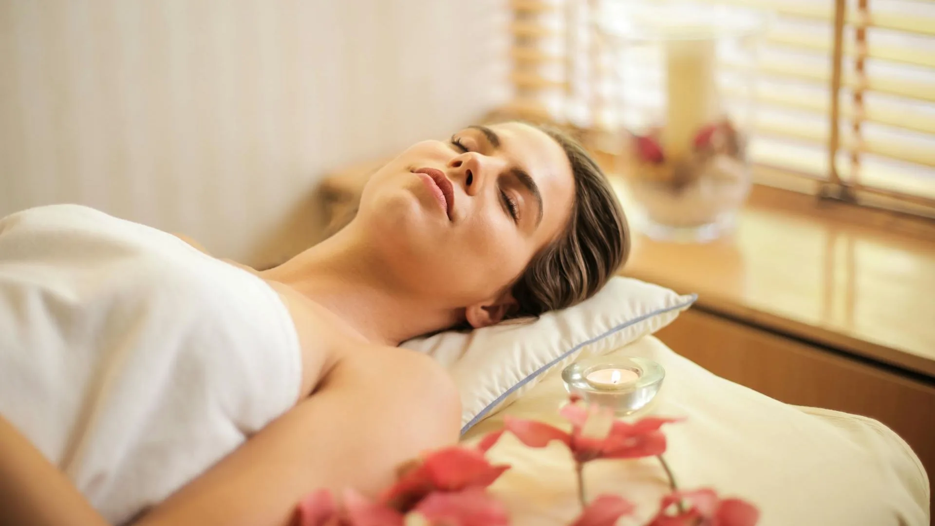 Private massage suite with warm linen and soft lighting