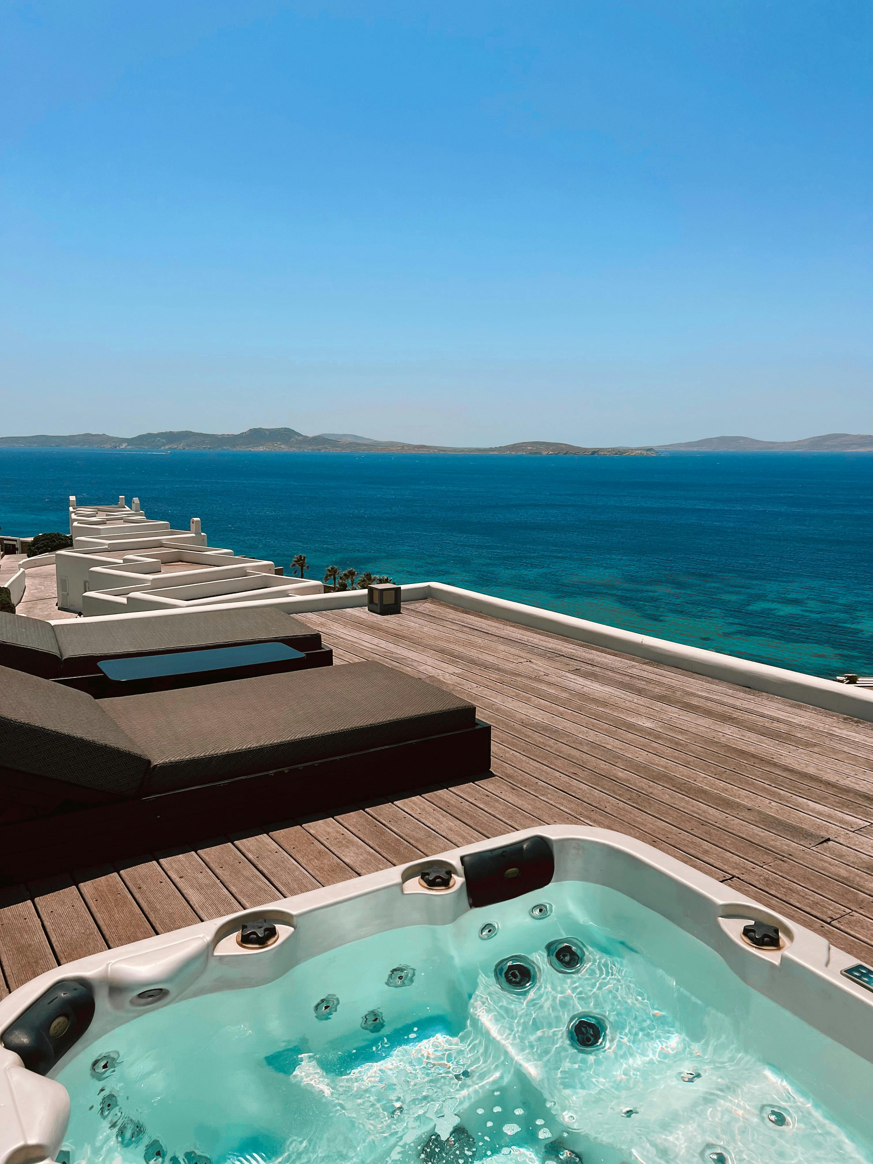 Modern spa building exterior with limestone and glass in coastal light