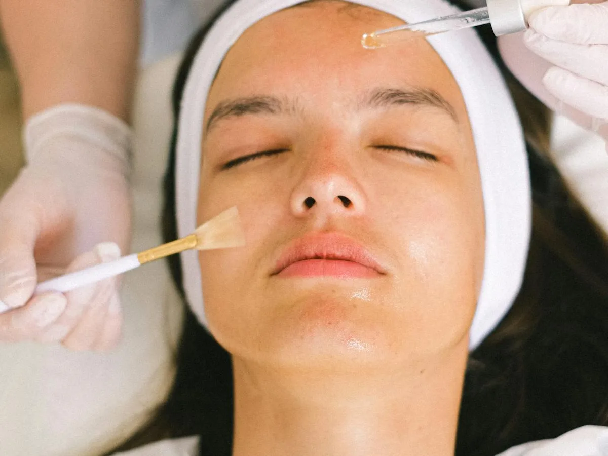 Restorative facial massage with cream applied in a serene suite